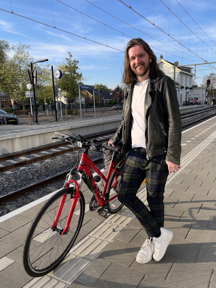 Me with my bike, at Zevenbergen train station in the Netherlands.